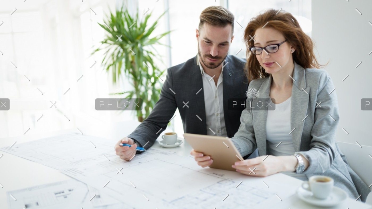 demo-attachment-818-portrait-of-young-architect-woman-on-meeting-KFZCE3A